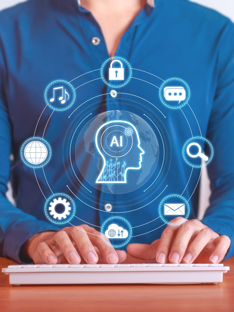 Pessoa digitando em teclado com ícones de inteligência artificial ao redor, representando os avanços tecnológicos na produtividade e automação